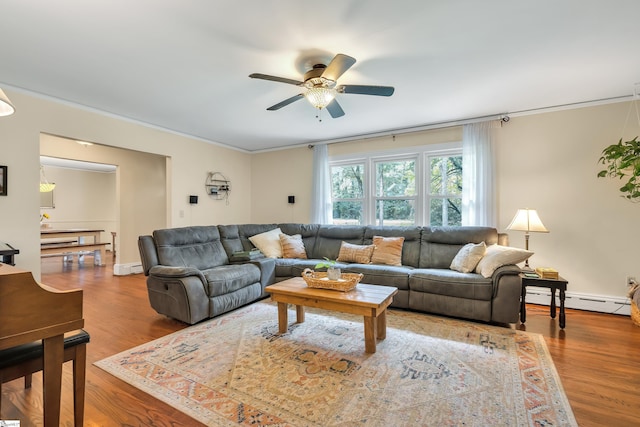 living room featuring ceiling fan, light wood-type flooring, and a baseboard heating unit