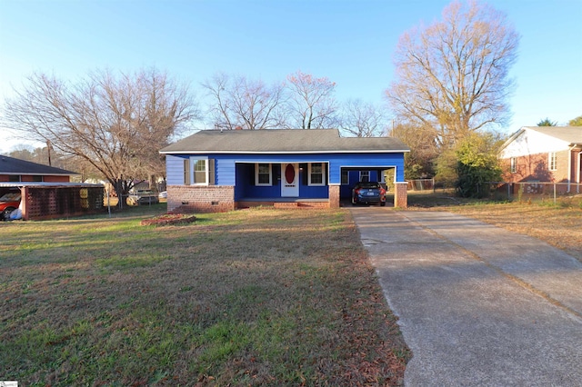 view of front of property with a garage and a front yard