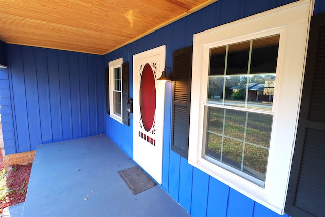 view of exterior entry with a porch