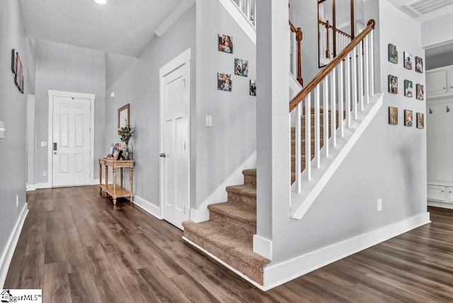 foyer with dark hardwood / wood-style flooring