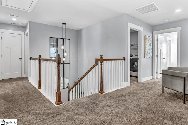 hallway with light carpet