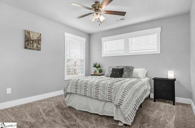 bedroom with ceiling fan and carpet flooring