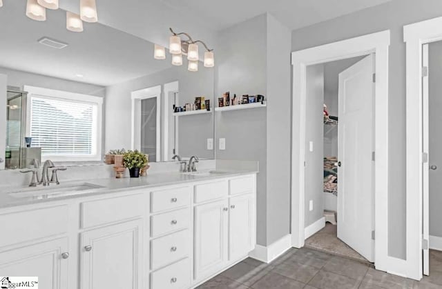 bathroom featuring tile patterned floors and vanity