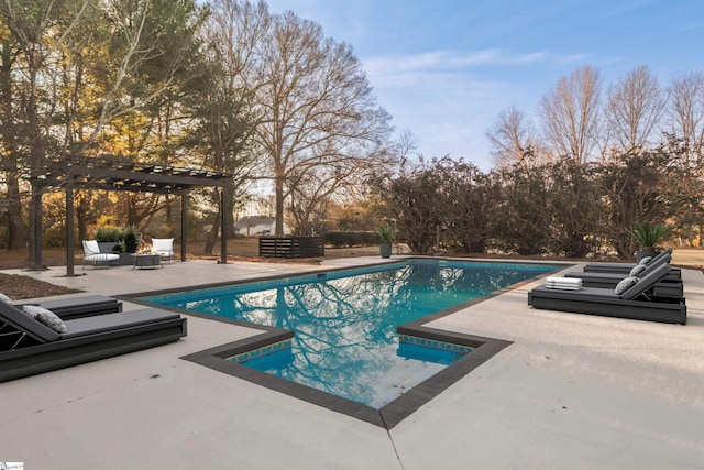 view of swimming pool with a patio and a pergola