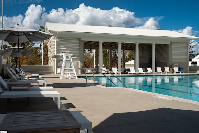 view of swimming pool featuring a patio area