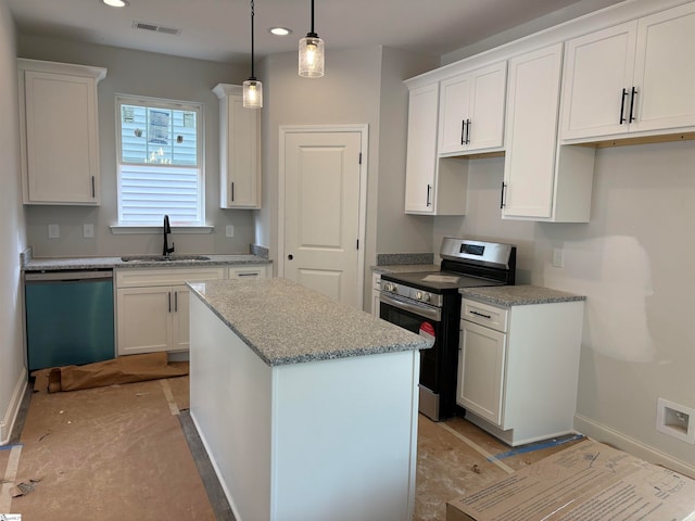 kitchen featuring appliances with stainless steel finishes, a kitchen island, sink, white cabinetry, and hanging light fixtures