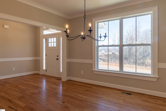 entrance foyer featuring hardwood / wood-style flooring and a wealth of natural light