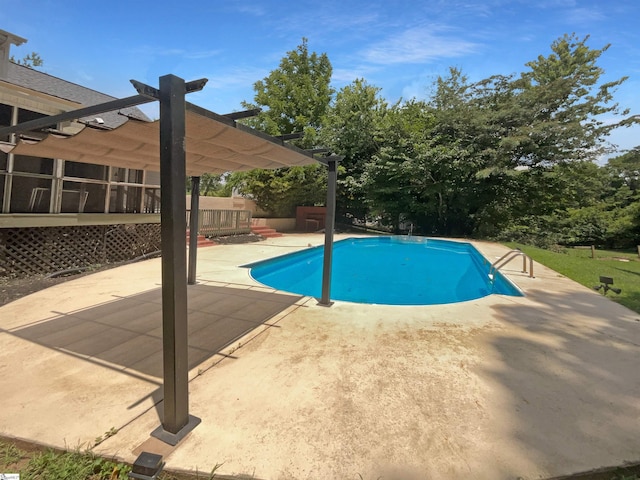 view of swimming pool featuring a pergola and a patio