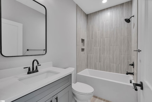 full bathroom featuring vanity, toilet, and shower / bath combination