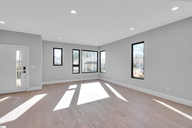 interior space featuring light hardwood / wood-style flooring and plenty of natural light