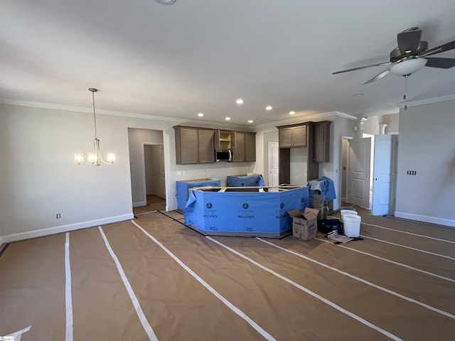 kitchen featuring ceiling fan with notable chandelier and crown molding