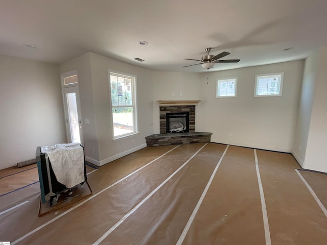 unfurnished living room featuring ceiling fan