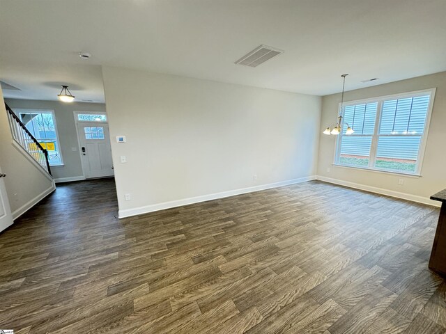 unfurnished living room with ceiling fan