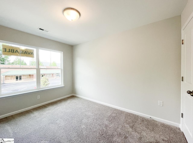 unfurnished room featuring carpet floors