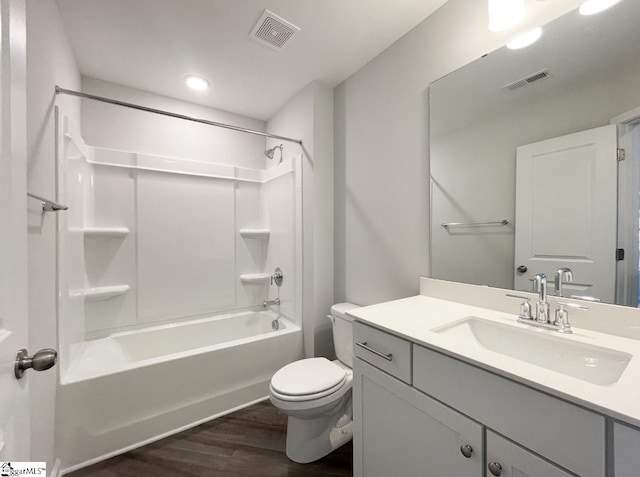 full bathroom with wood-type flooring, toilet, vanity, and shower / bathing tub combination