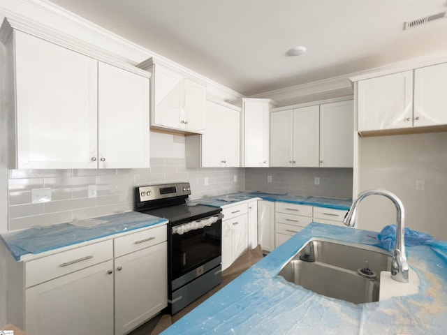 kitchen with sink, white cabinetry, ornamental molding, decorative backsplash, and stainless steel range with electric cooktop