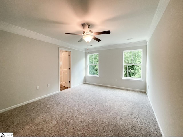 carpeted empty room with crown molding and ceiling fan