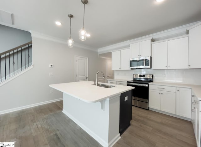 kitchen featuring a kitchen island with sink, sink, white cabinets, and appliances with stainless steel finishes