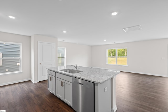 kitchen with light stone counters, dark wood finished floors, recessed lighting, a sink, and dishwasher