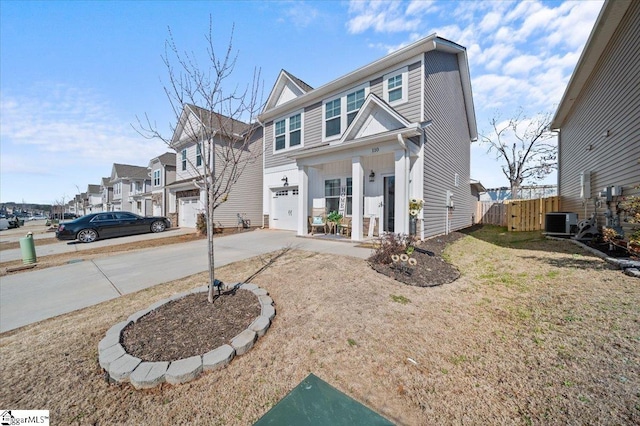 view of front facade featuring central AC and a garage