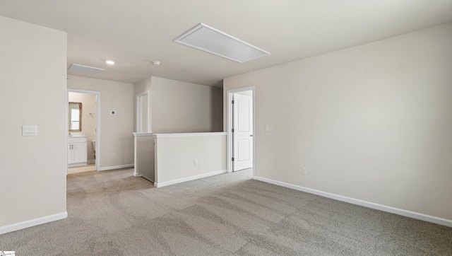 empty room featuring light carpet