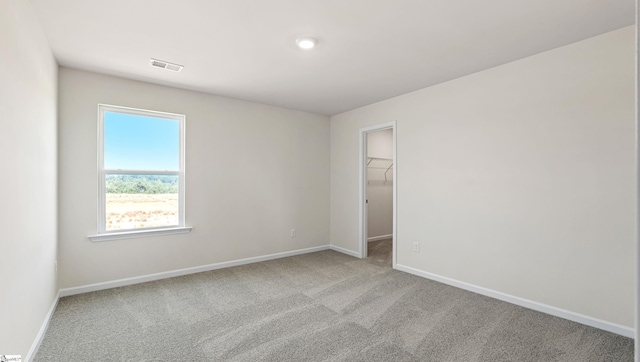 empty room with light colored carpet