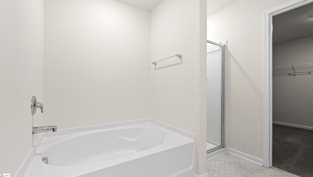 bathroom with plus walk in shower and tile patterned floors