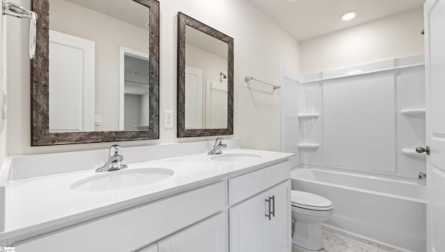 full bathroom with vanity, toilet, and shower / washtub combination