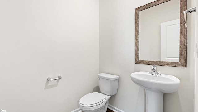 bathroom with toilet and sink