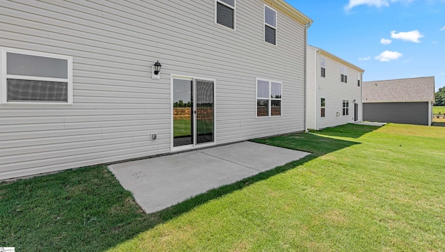 back of house with a lawn and a patio