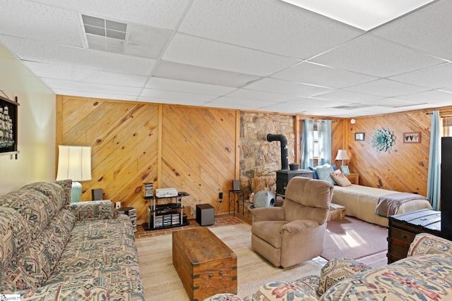 728 Tall Oak Trl, Seneca, SC 29678 - living room with wood walls, a drop ceiling, and a wood stove