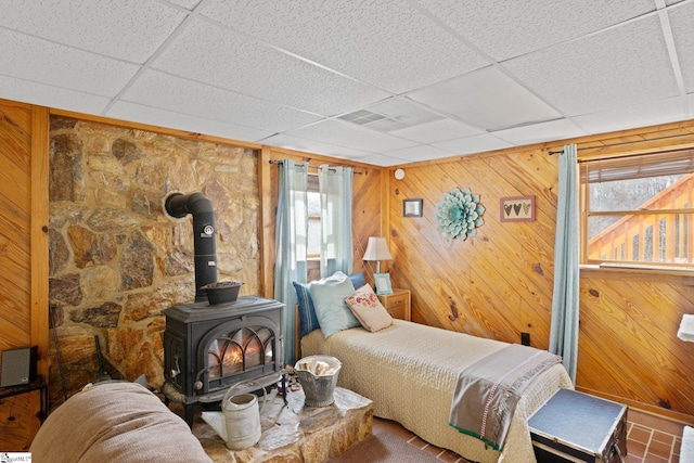 728 Tall Oak Trl, Seneca, SC 29678 - bedroom with wood walls, a drop ceiling, and a wood stove