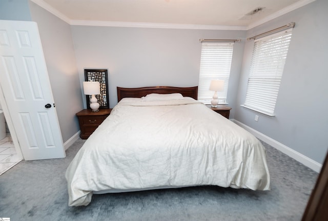 carpeted bedroom featuring crown molding