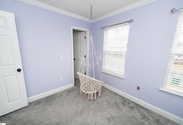 carpeted empty room featuring ornamental molding