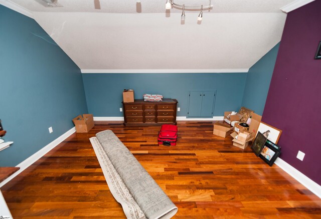 bedroom with dark hardwood / wood-style flooring and ornamental molding