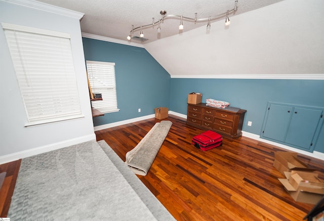 bedroom featuring ornamental molding, dark wood-type flooring, and a textured ceiling