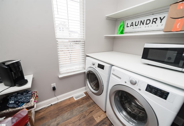 laundry room featuring separate washer and dryer and dark wood-type flooring