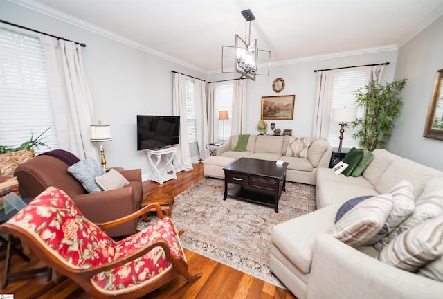 living room with a chandelier, wood-type flooring, and a wealth of natural light