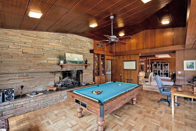 recreation room featuring a fireplace, wood walls, high vaulted ceiling, and pool table