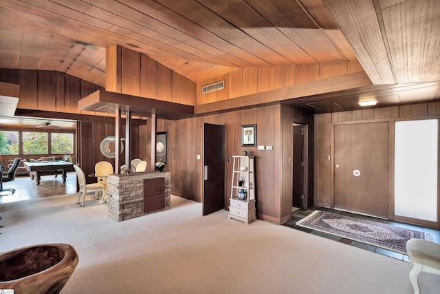 interior space with billiards, wooden ceiling, wood walls, and carpet