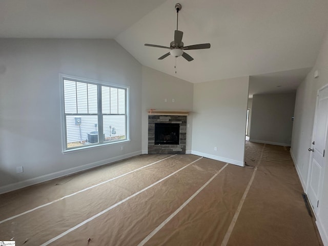 unfurnished living room with a fireplace, ceiling fan, and lofted ceiling