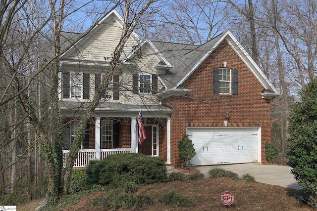 front facade with a porch and a garage