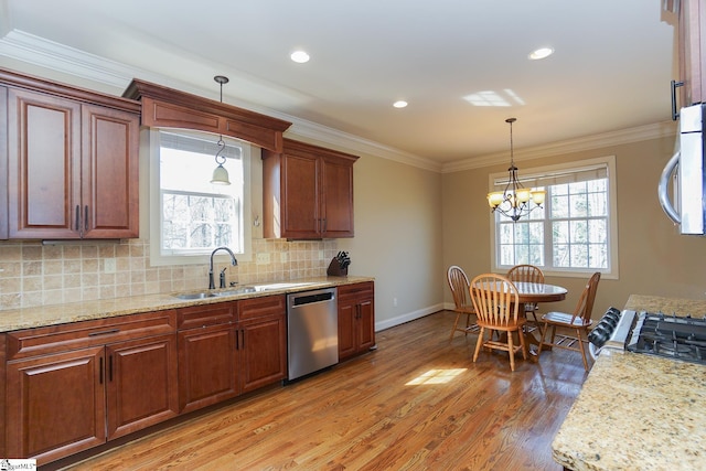 kitchen with an inviting chandelier, backsplash, light stone counters, light hardwood / wood-style floors, and dishwasher