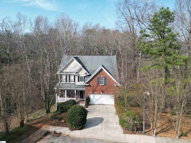 view of front of home with covered porch and a garage