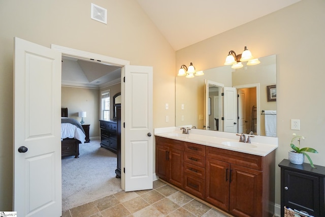 bathroom with lofted ceiling, tile flooring, double sink, and oversized vanity