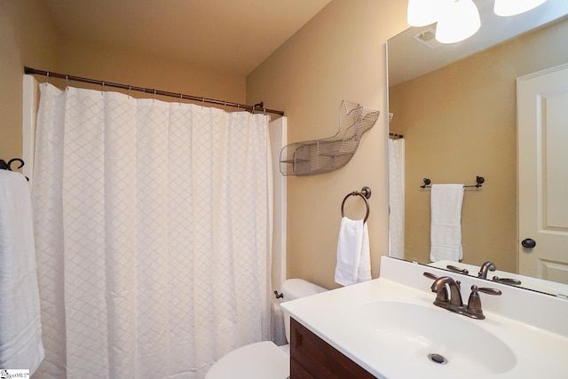 bathroom with toilet and oversized vanity