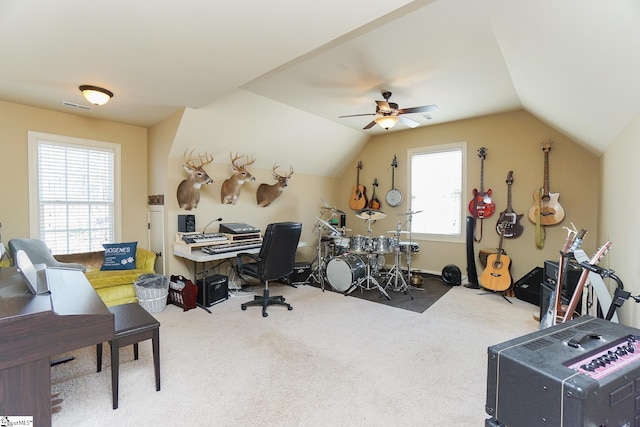 home office featuring vaulted ceiling, carpet flooring, and ceiling fan