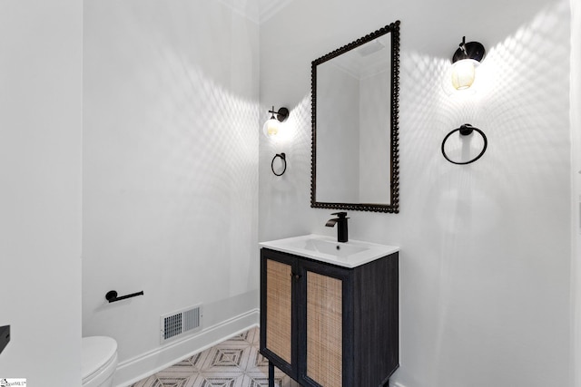 bathroom featuring oversized vanity, toilet, and tile flooring