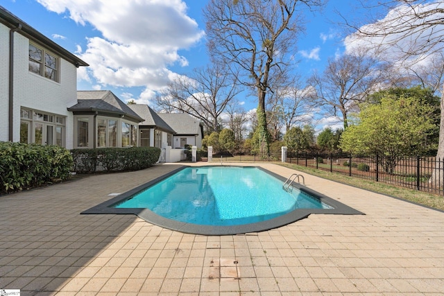 view of swimming pool with a patio