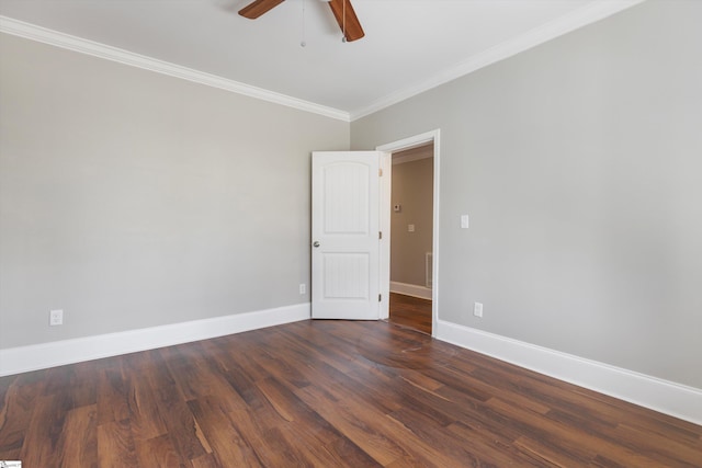 empty room with crown molding, dark hardwood / wood-style floors, and ceiling fan